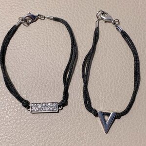 Set Of Two Black Corded Bracelets With Charm